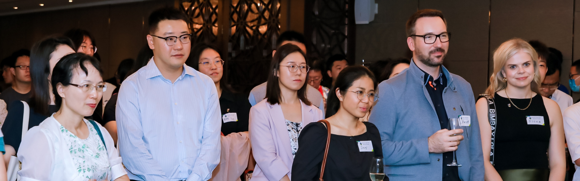 UCD alumni listening to a speaker at a global event in Beijing.